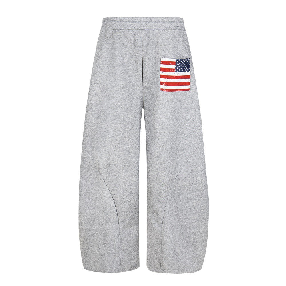 Embroidered sports pants with adhesive fabric