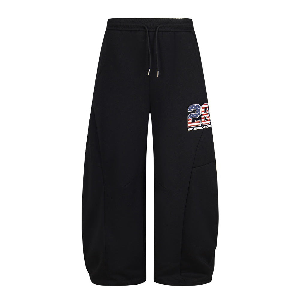 Embroidered sports pants with adhesive fabric